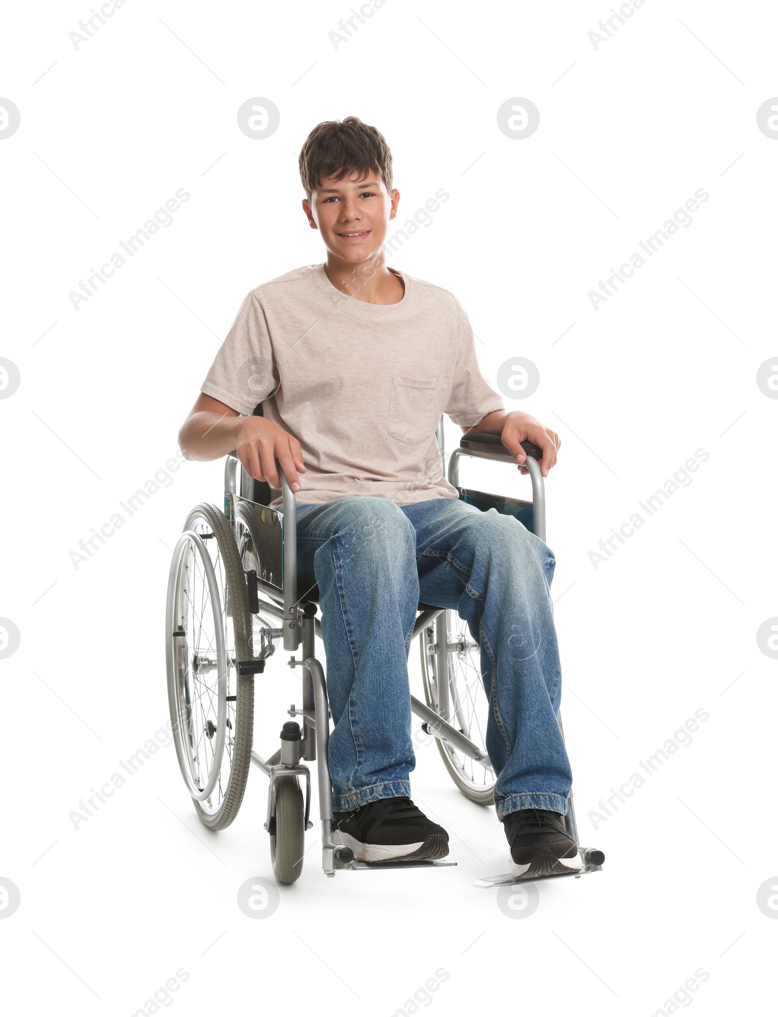 Photo of Happy teenage boy in modern wheelchair on white background