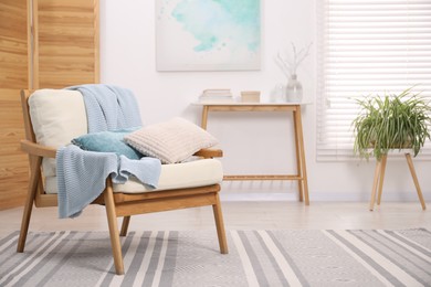 Photo of Comfortable armchair in living room. Interior design