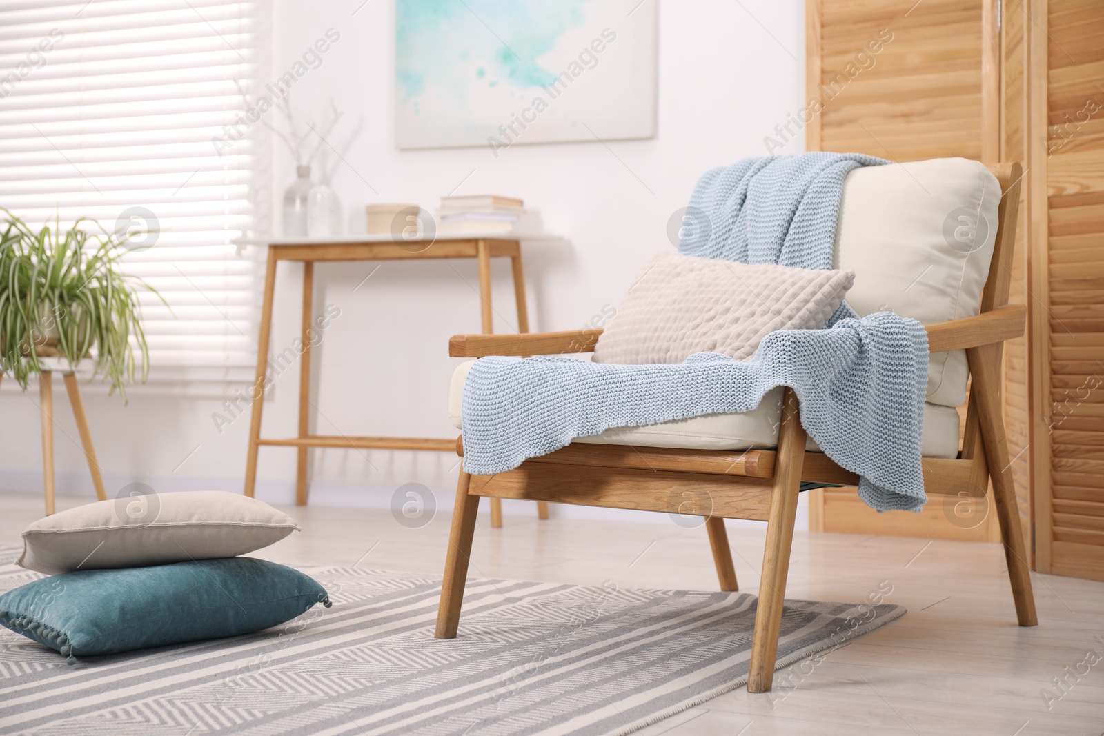 Photo of Comfortable armchair in living room. Interior design