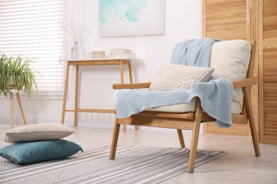 Photo of Comfortable armchair in living room. Interior design