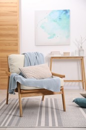 Photo of Comfortable armchair in living room. Interior design