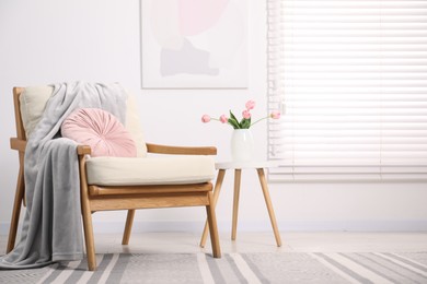 Photo of Comfortable armchair in living room. Interior design