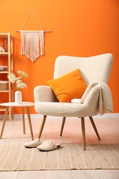 Photo of Comfortable armchair in living room. Interior design