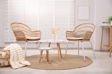 Photo of Comfortable armchairs and other furniture in living room. Interior design