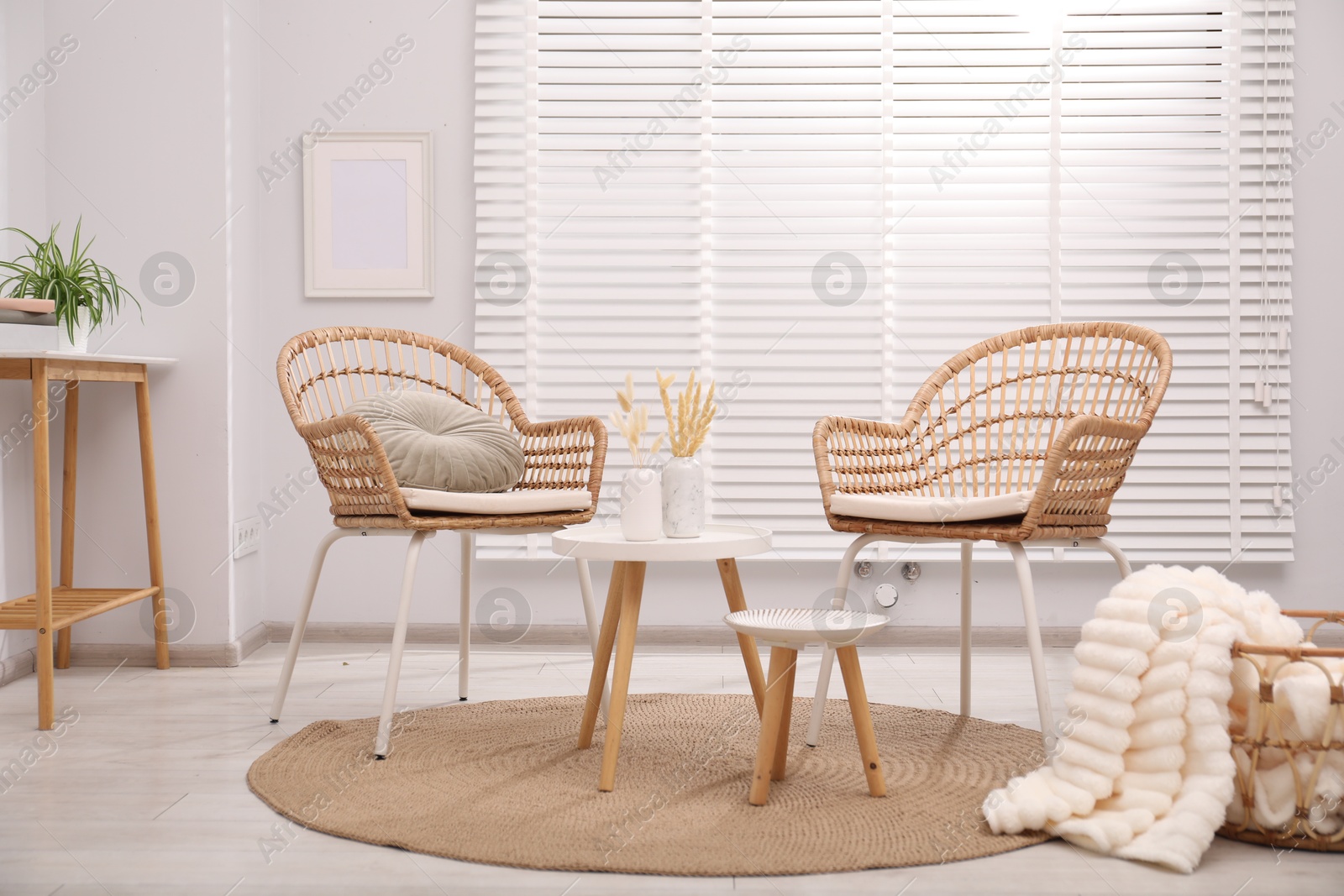 Photo of Comfortable armchairs and other furniture in living room. Interior design