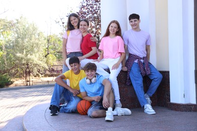 Photo of Portrait of happy teenage friends together outdoors