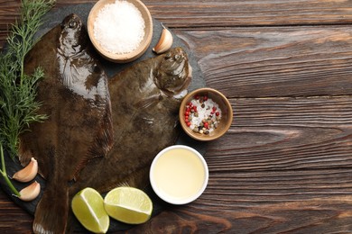 Photo of Fresh flounder fish, spices and products on wooden table, flat lay with space for text. Raw seafood