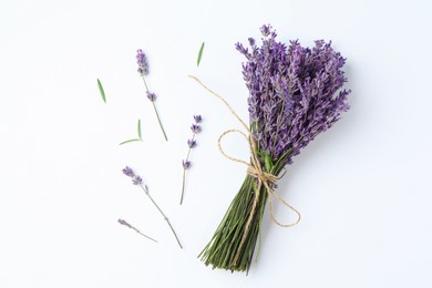 Photo of Bunch of beautiful lavender flowers, leaves and sprigs on white background, flat lay