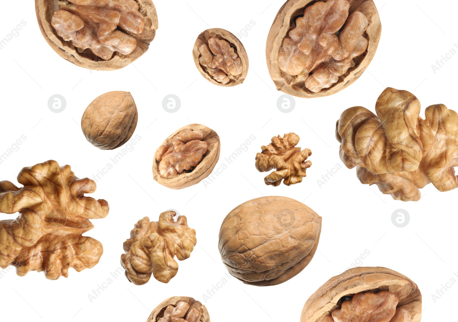 Image of Walnuts swirling in air against white background