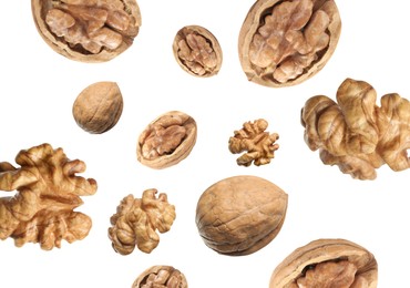 Image of Walnuts swirling in air against white background
