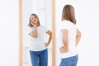 Image of Beautiful senior woman looking at herself in mirror indoors. Mental health