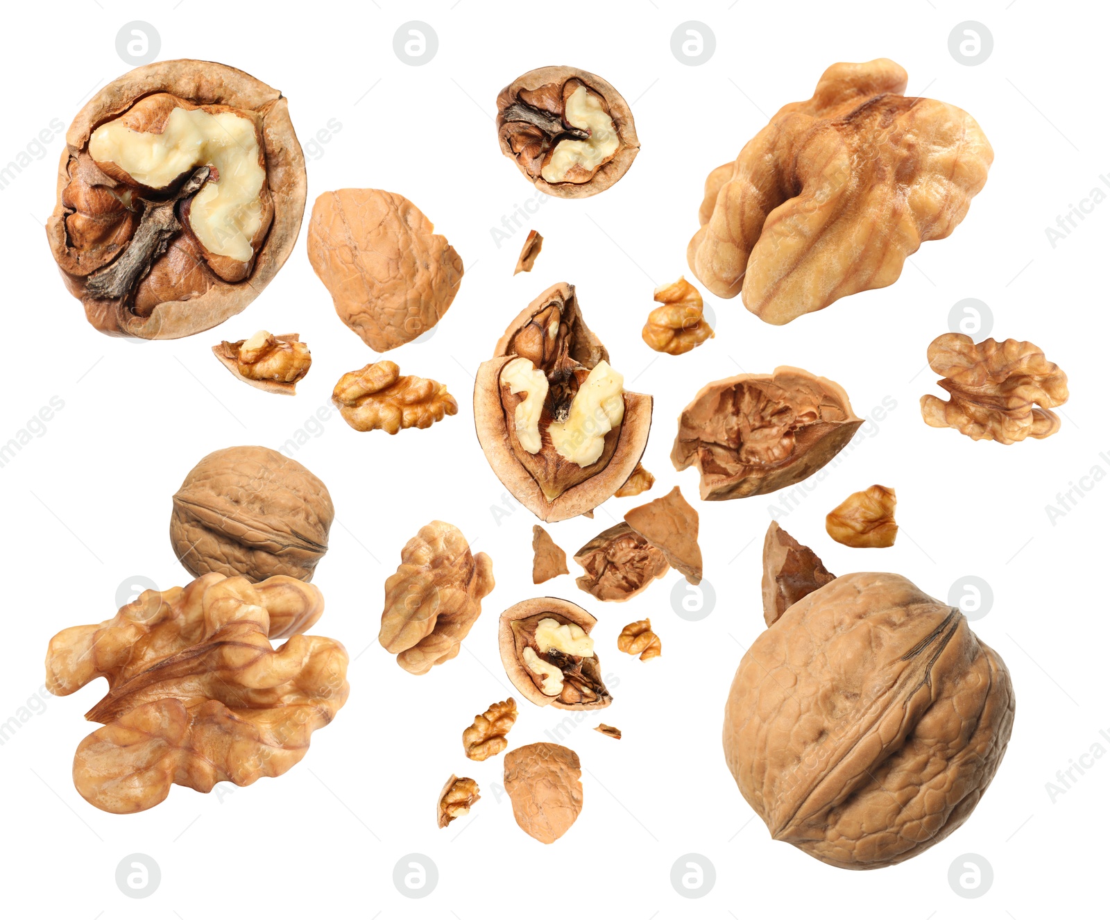 Image of Walnuts swirling in air against white background