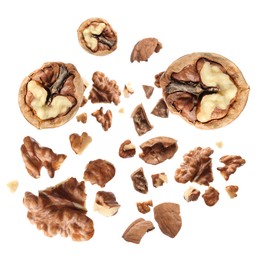 Image of Walnuts swirling in air against white background