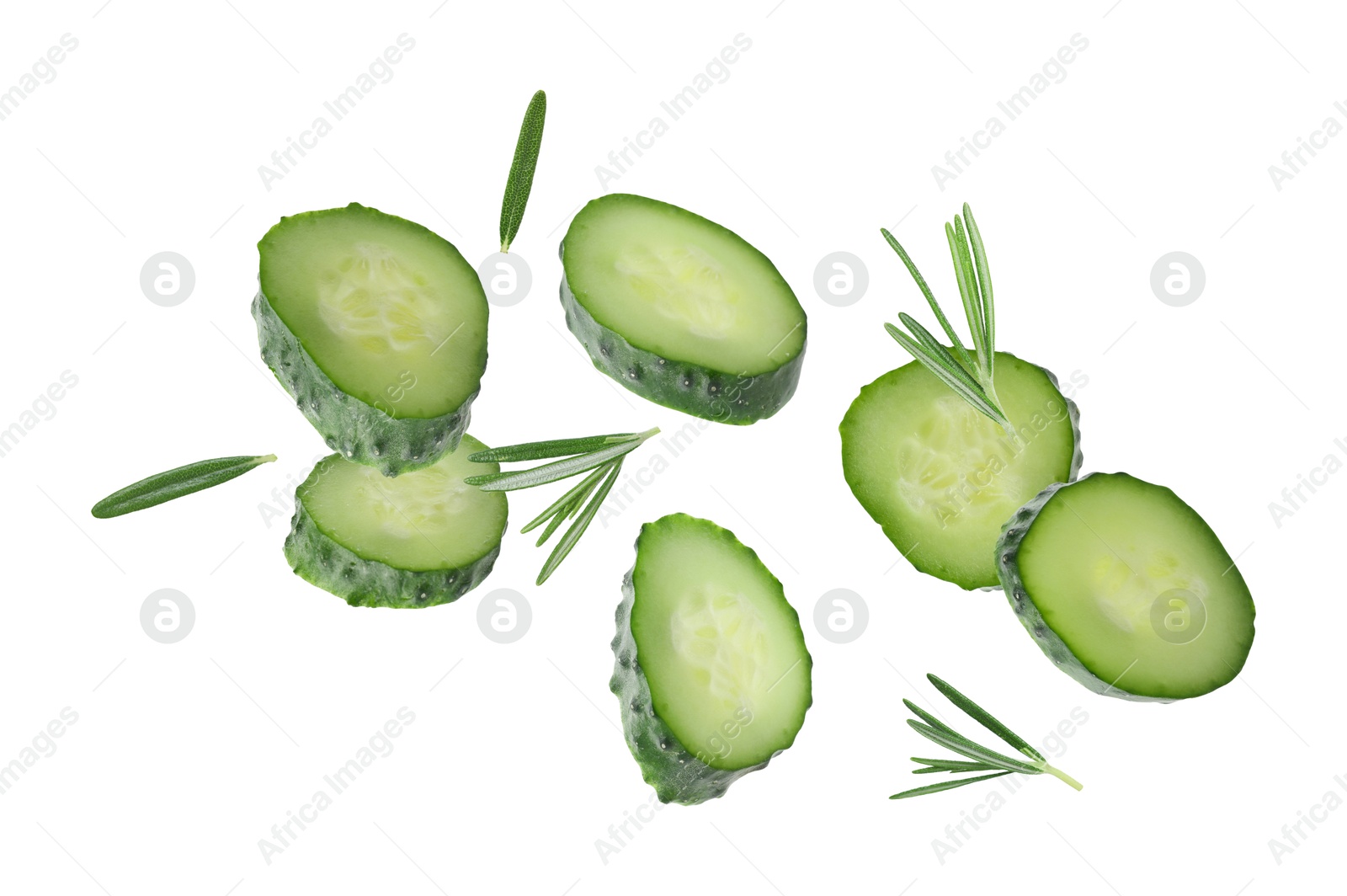 Image of Cucumber slices and rosemary flying against white background