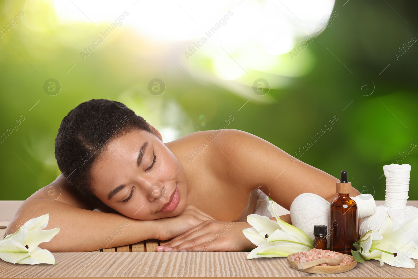 Beautiful woman relaxing on bamboo mat against blurred green background. Spa center Image of Beautiful woman relaxing on bamboo mat against blurred green background. Spa center