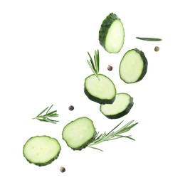 Image of Cucumber slices and rosemary flying against white background