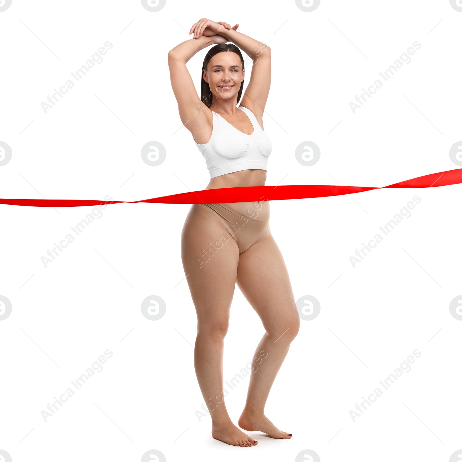 Woman showing her body on white background, before and after. Collage divided by red ribbon demonstrating result of liposuction or weight loss Image of Woman showing her body on white background, before and after. Collage divided by red ribbon demonstrating result of liposuction or weight loss