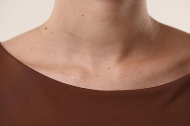 Photo of Woman with healthy skin on light background, closeup