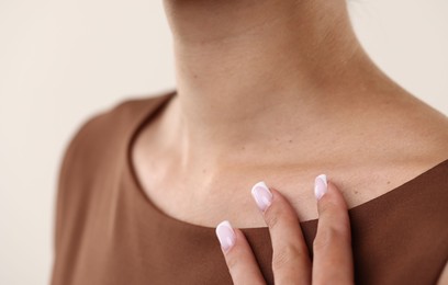 Photo of Woman with healthy skin on light background, closeup