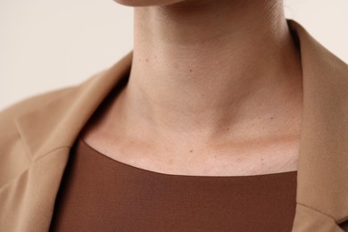 Photo of Woman with healthy skin on light background, closeup