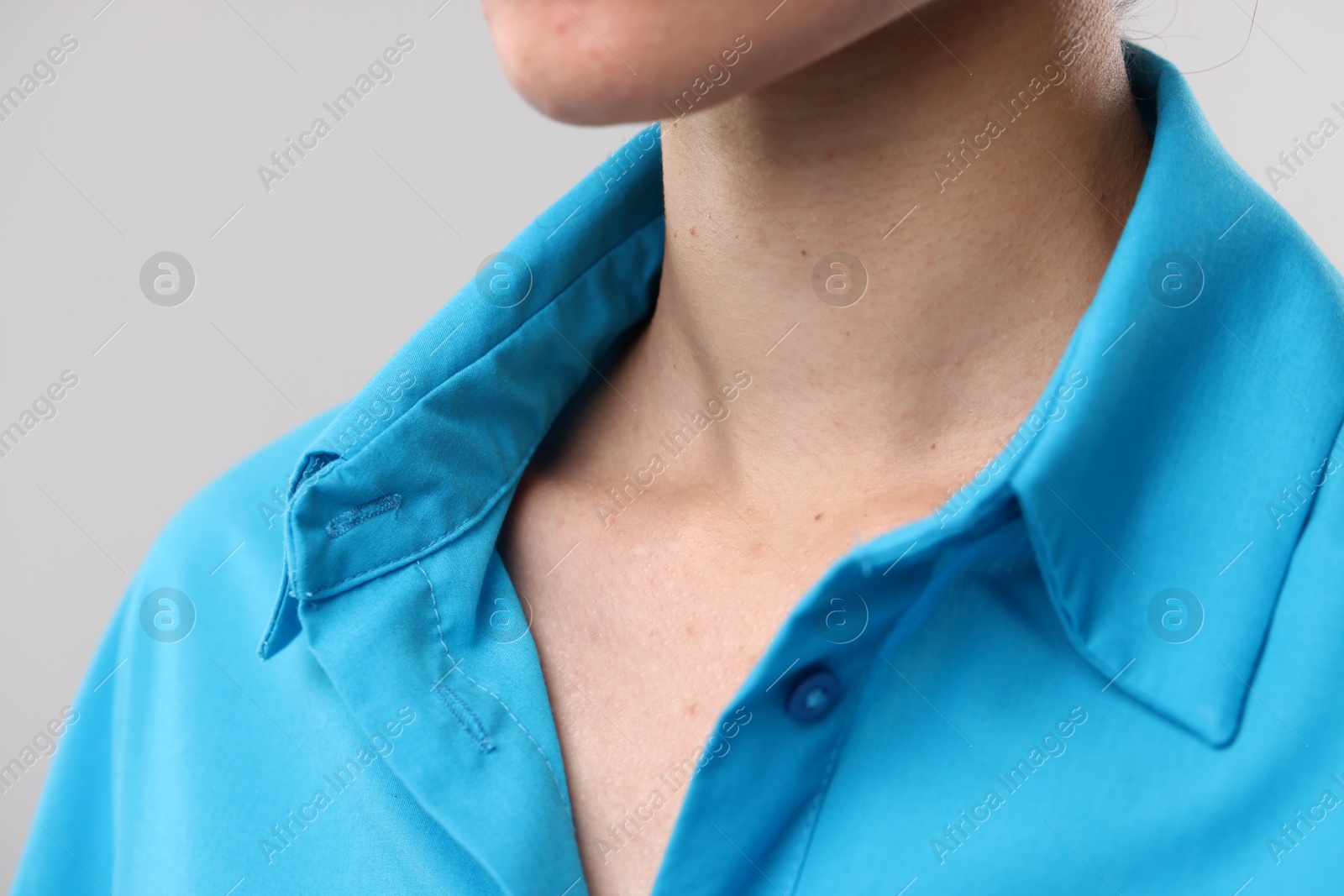 Photo of Closeup view of woman on light grey background