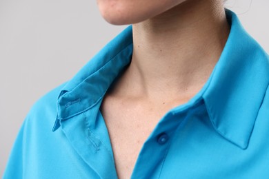 Photo of Closeup view of woman on light grey background