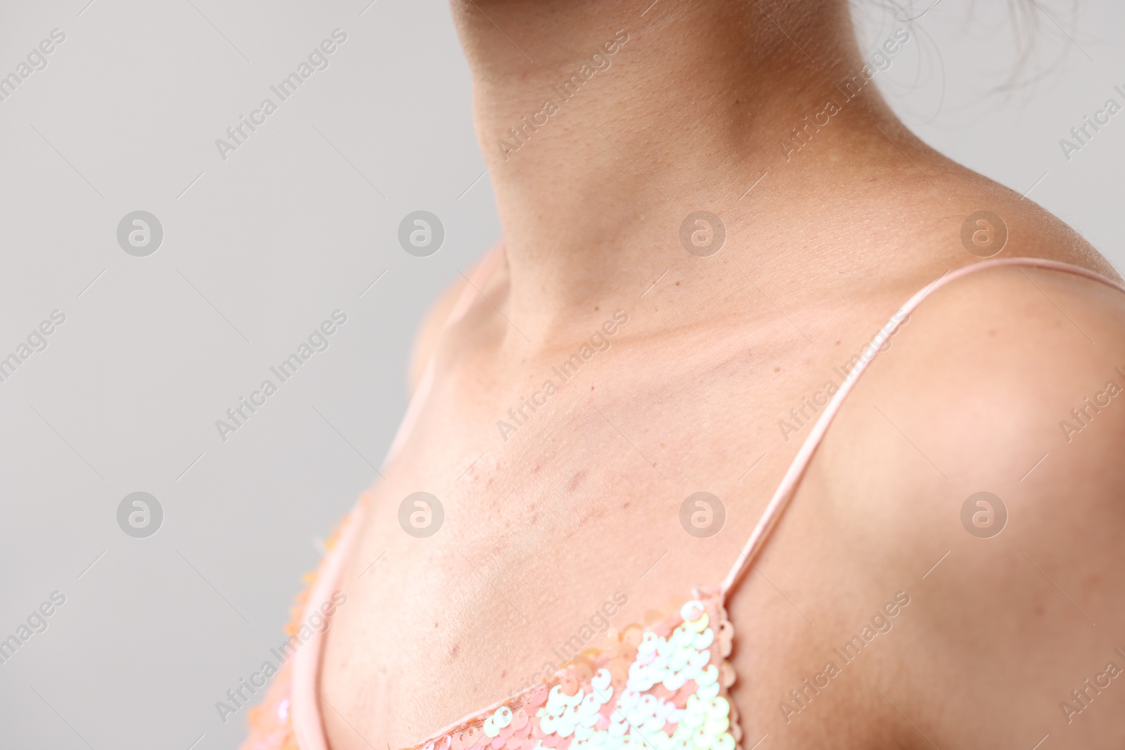 Photo of Closeup view of woman on light grey background