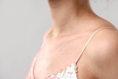 Photo of Closeup view of woman on light grey background