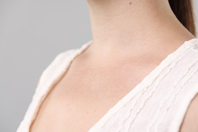 Photo of Closeup view of woman on light grey background