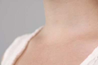 Photo of Closeup view of woman on light grey background