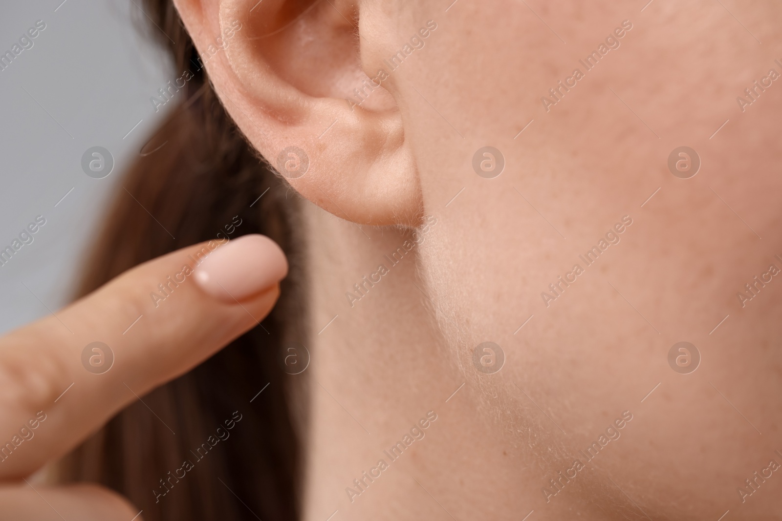 Photo of Closeup view of woman on grey background