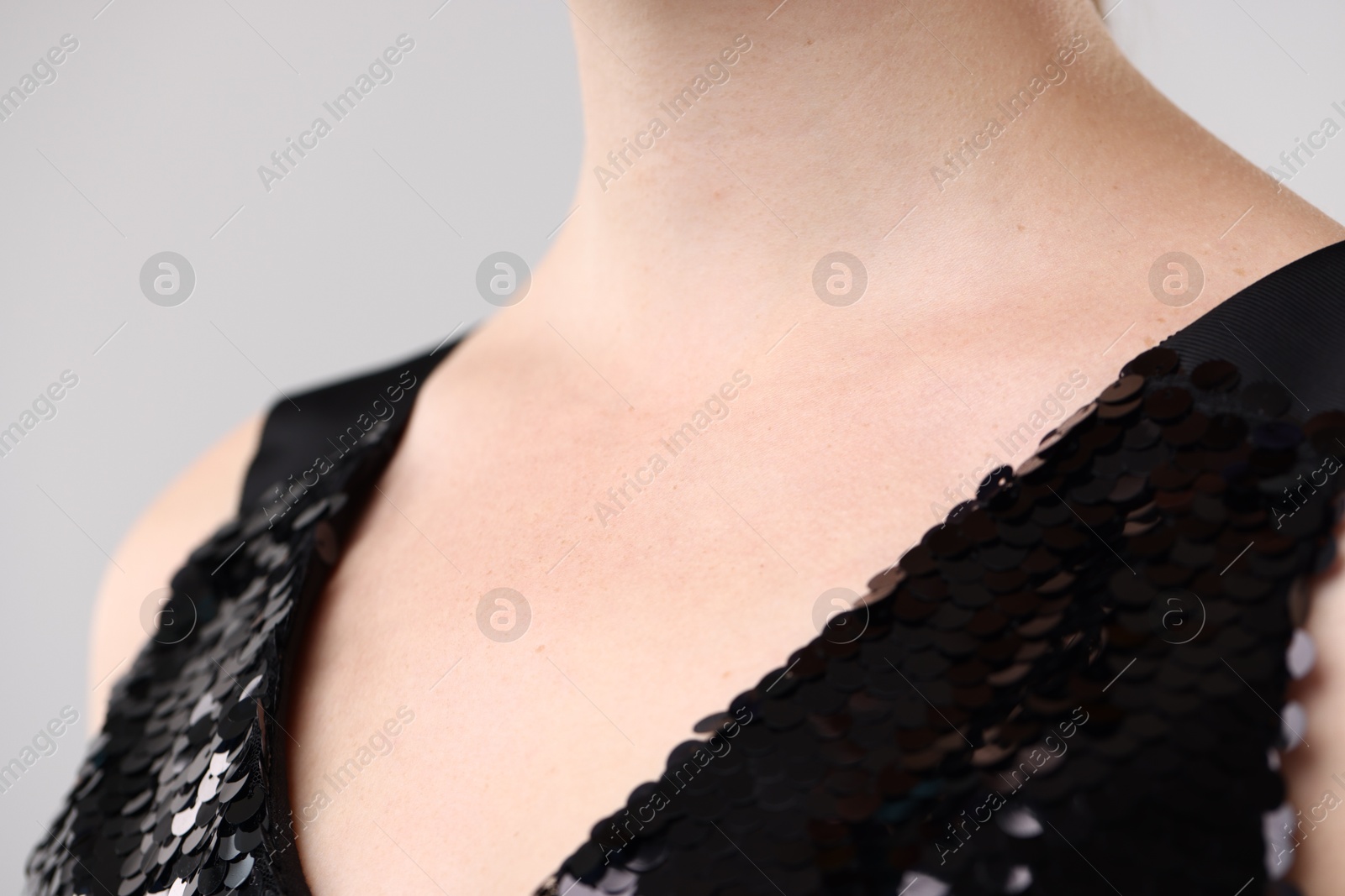 Photo of Closeup view of woman on light grey background