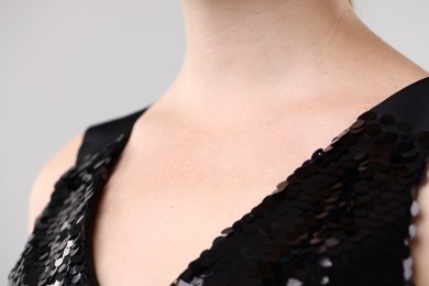 Photo of Closeup view of woman on light grey background