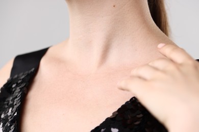 Photo of Closeup view of woman on light grey background