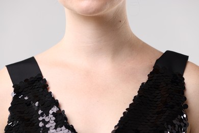 Photo of Closeup view of woman on light grey background