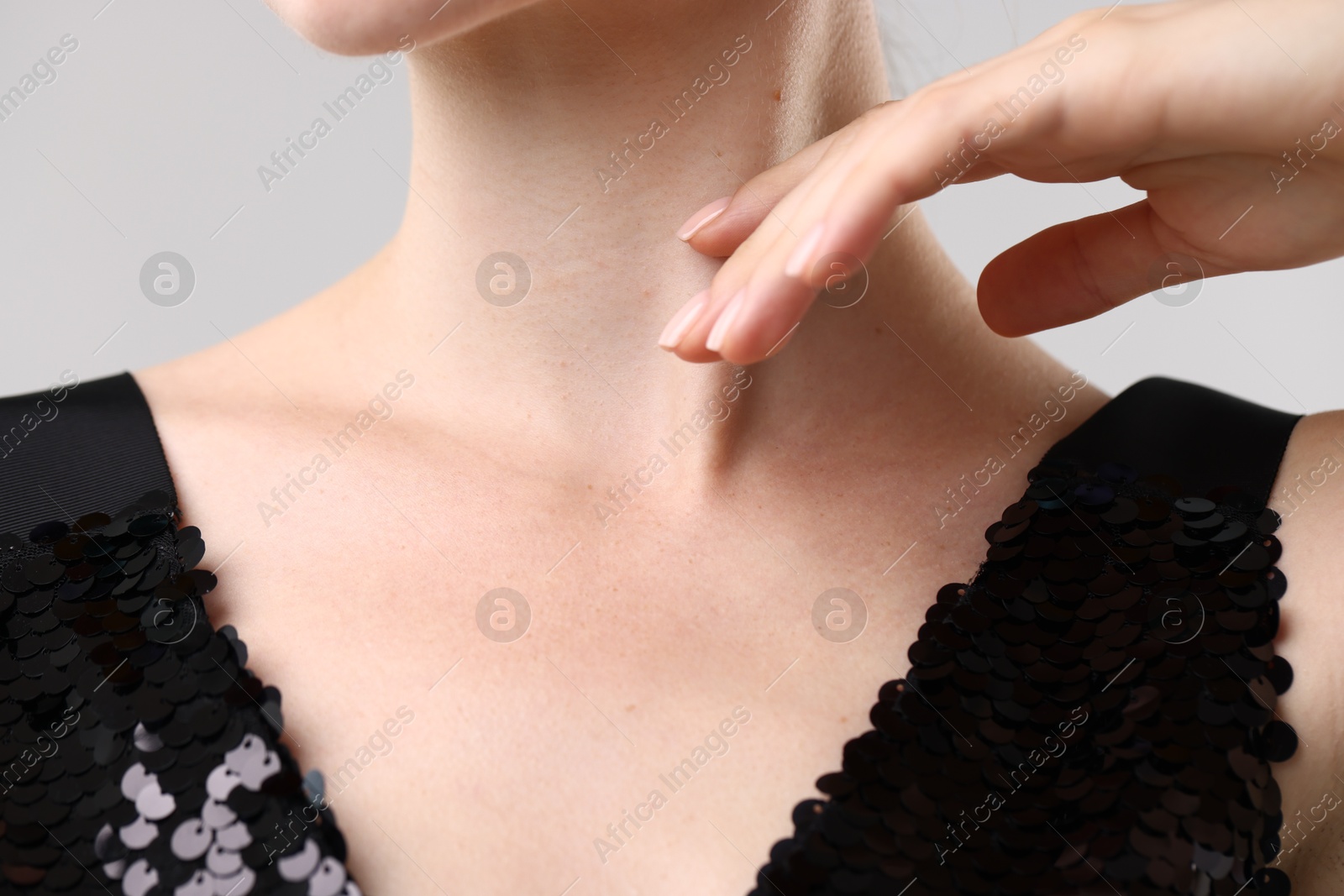 Photo of Closeup view of woman on light grey background