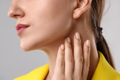 Photo of Closeup view of woman on grey background