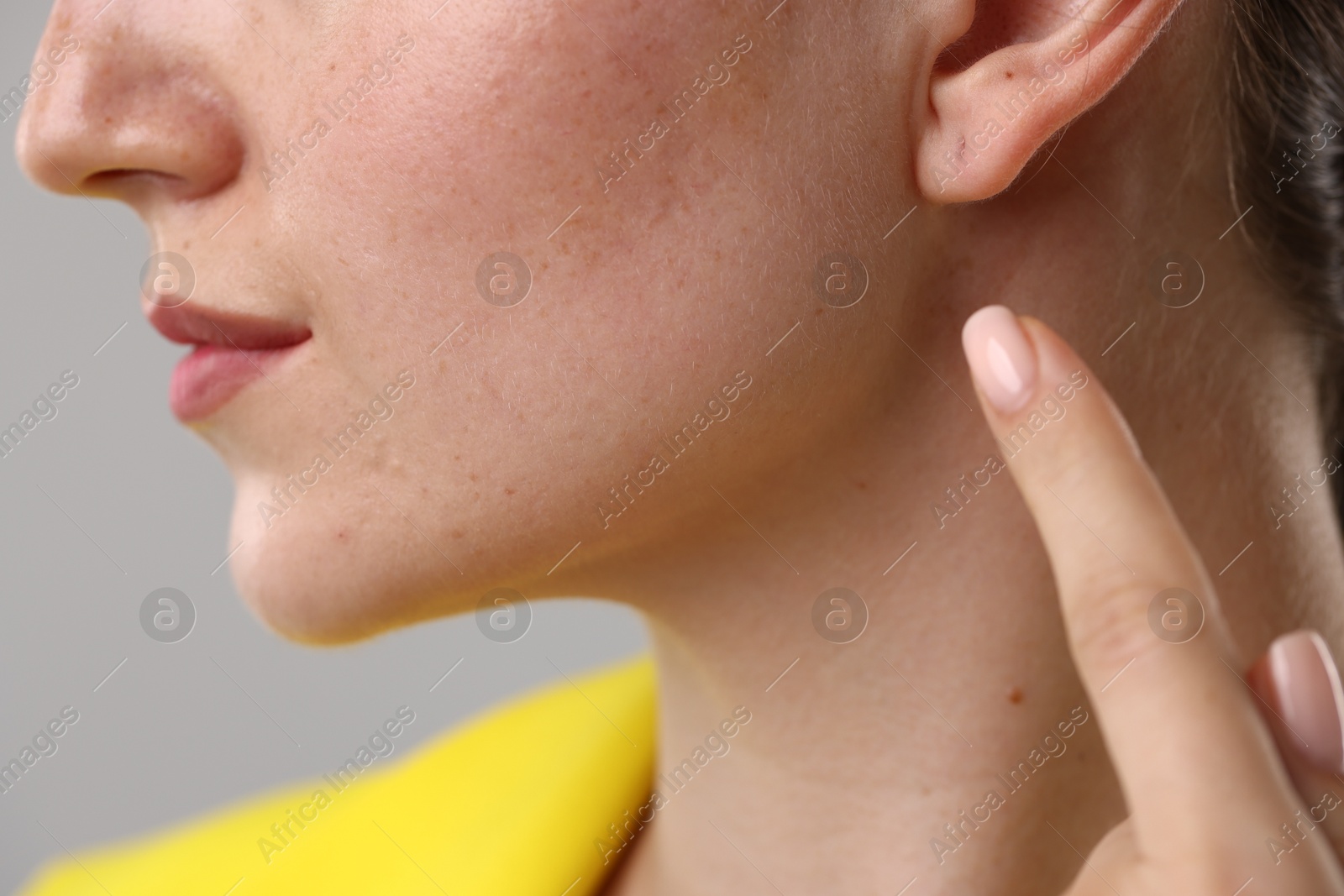 Photo of Closeup view of woman on grey background