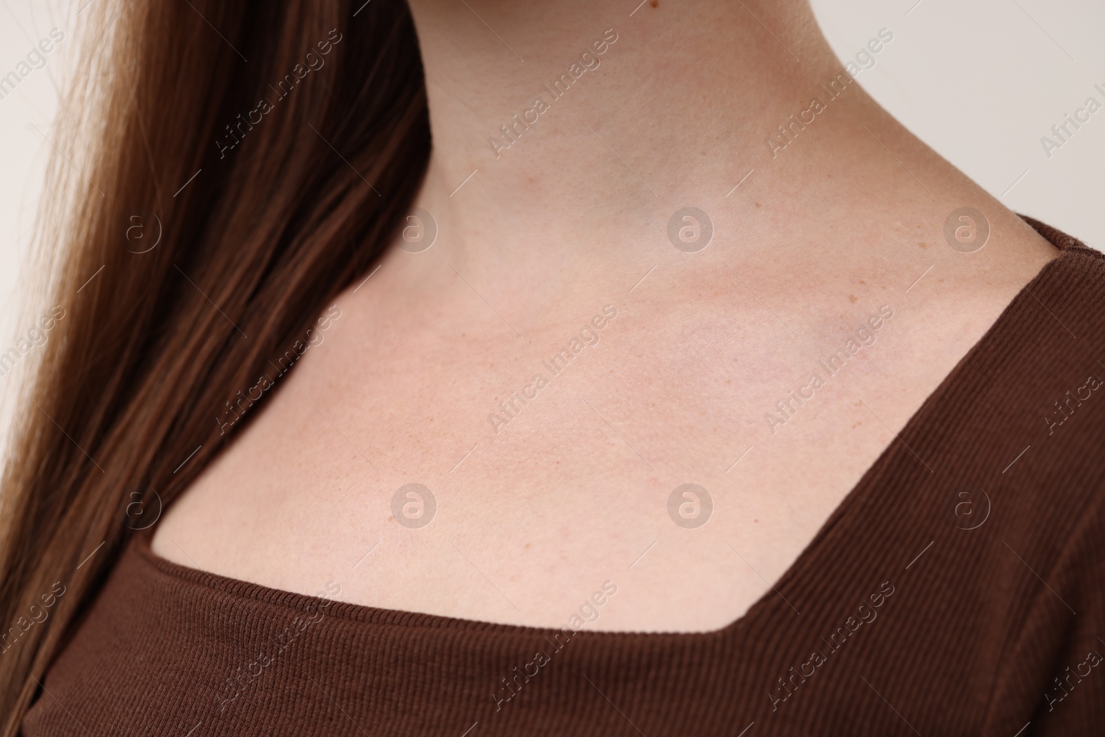 Photo of Closeup view of woman on light grey background