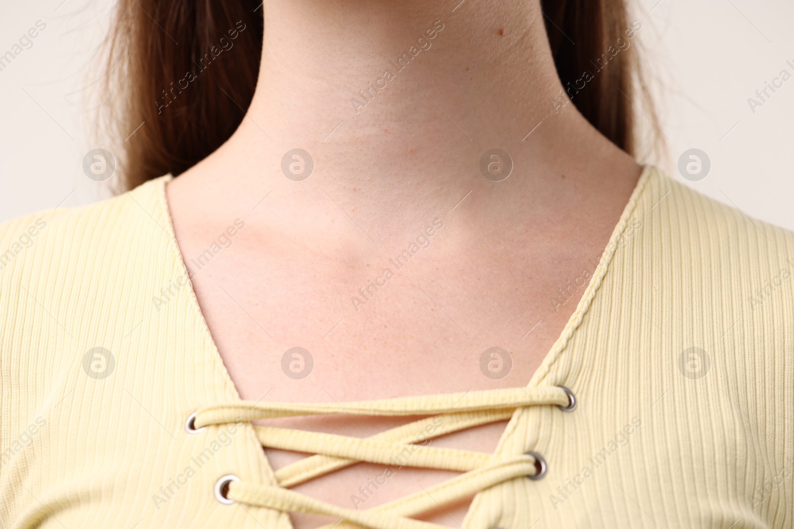 Photo of Closeup view of woman on light grey background