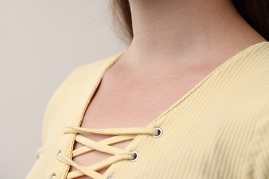 Photo of Closeup view of woman on grey background