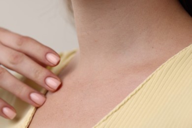 Photo of Closeup view of woman on grey background
