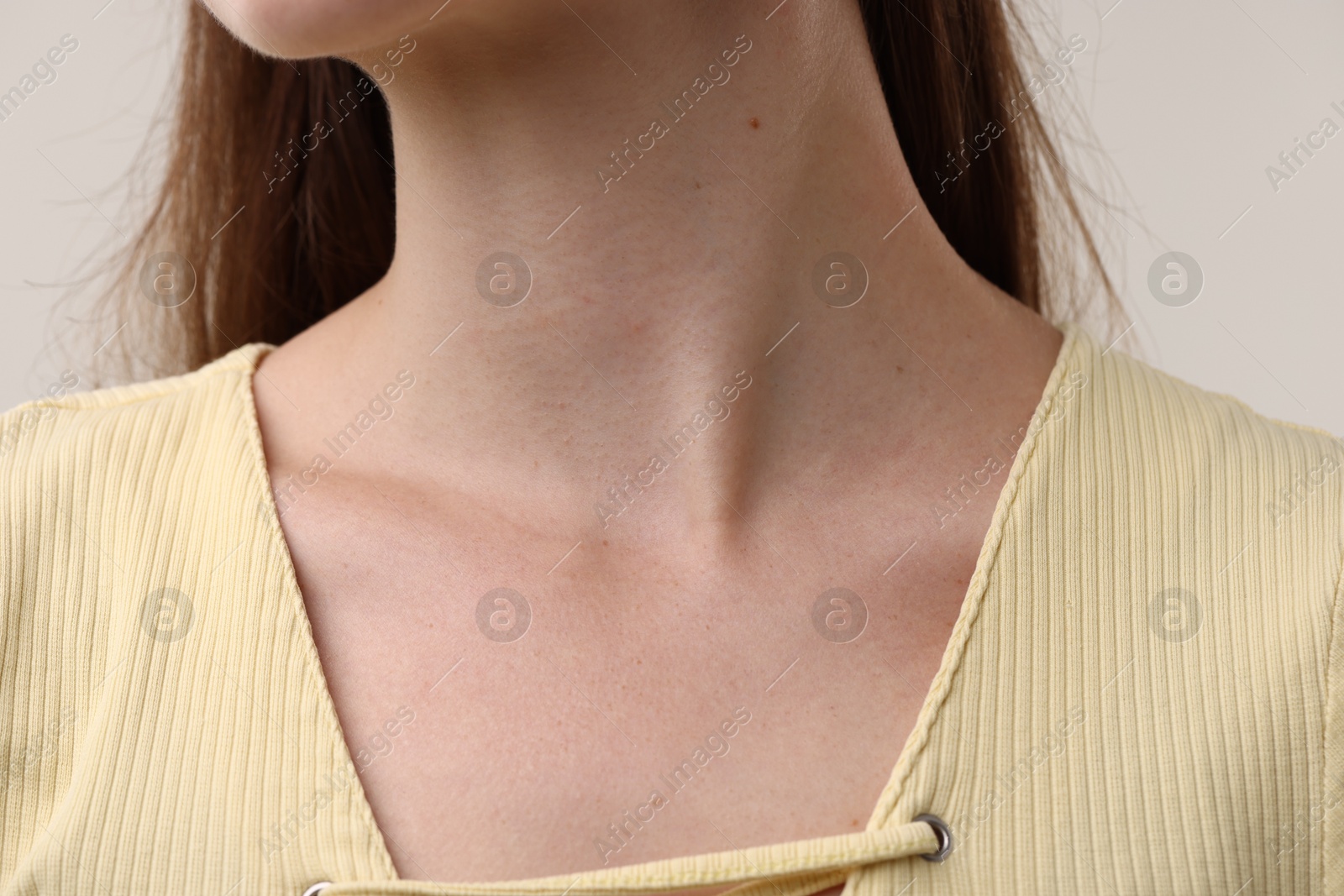Photo of Closeup view of woman on grey background