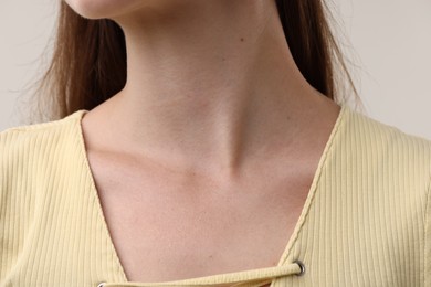 Photo of Closeup view of woman on grey background