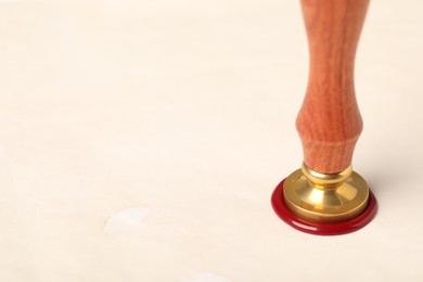 Photo of Sealing paper with wax stamp, closeup. Space for text