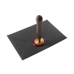 Photo of Sealing black envelope with wax stamp isolated on white