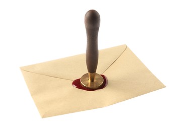 Photo of Sealing envelope with wax stamp isolated on white