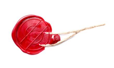 Photo of Red wax seal with twine isolated on white, top view