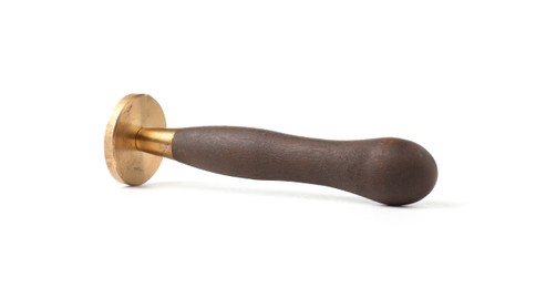Photo of One wax stamp with wooden handle isolated on white
