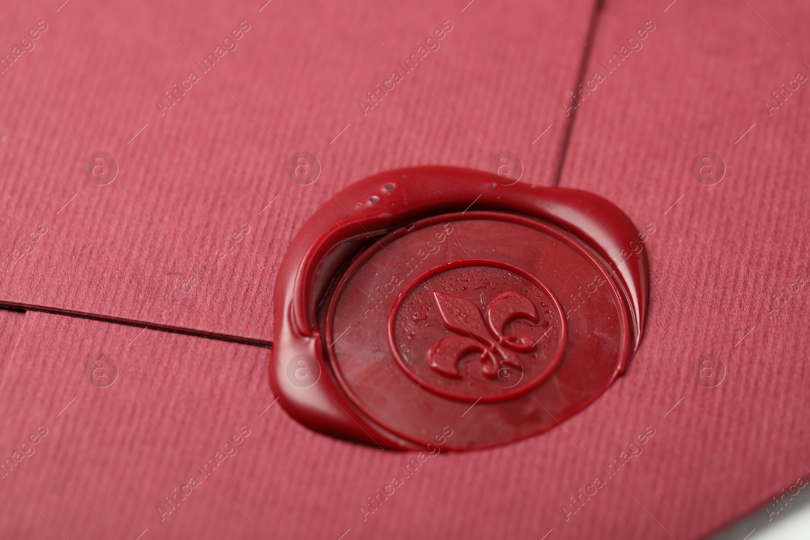 Beautiful envelope with red wax seal as background, closeup Photo of Beautiful envelope with red wax seal as background, closeup
